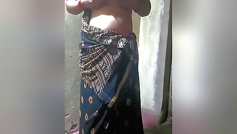 Indian solo female 18+ wears a white dress and black sweater