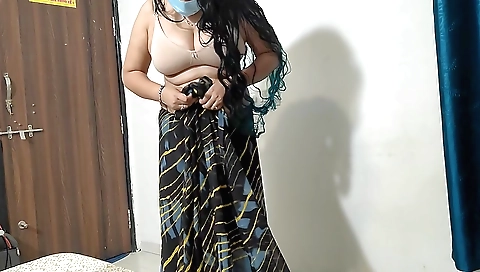 Indian girl in her stepmom's clothes is wearing a dress