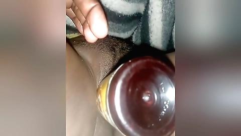 Hairy pussy of the girl is being filled with sex toys
