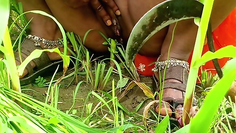 Indian girl plays with her body outdoors in the field