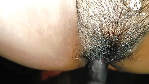 Indian girl is fingering her hairy pussy on the table