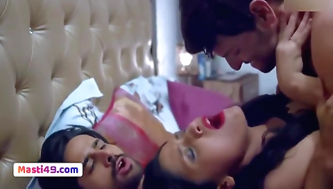 Busty brunette rides a big black dick in a threeway