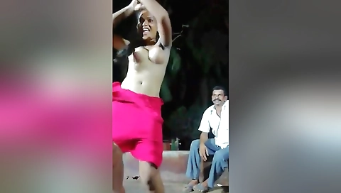 Sexy brunette indian girl in a sexy outfit moves around