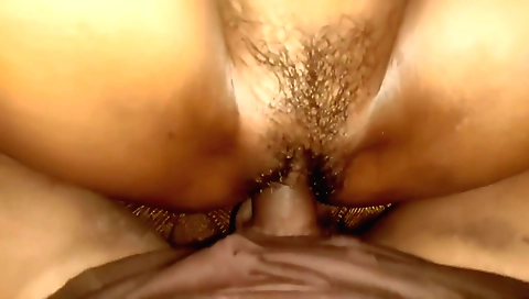 Indian brunette in a pink dress fucks a hairy pussy