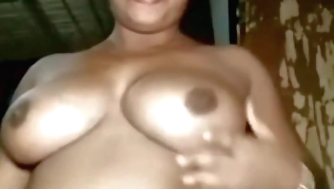 Busty brunette with a hairy pussy is in the bed and playing