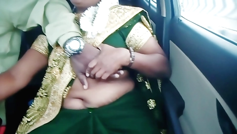 Indian chick in sexy outfit talks with a guy in a car