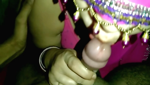 Indian woman sucking dick on a white blanket in a bedroom