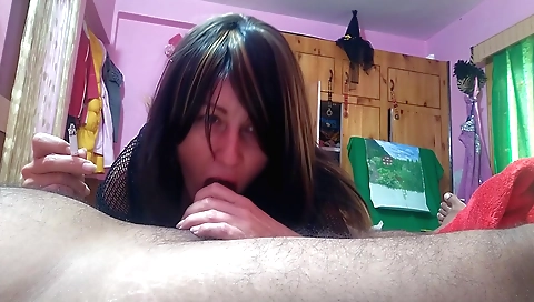 Indian girl giving a nice handjob while smoking cigarette