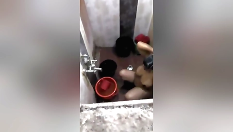 Indian brunette is naked in the shower and masturbating