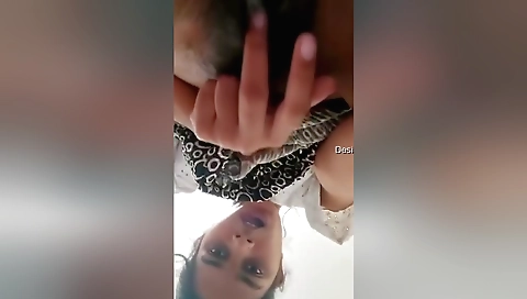 Indian babe plays with her hairy pussy and fingers it