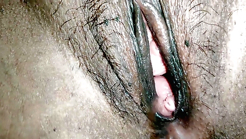 Hairy pussy in an orange dress in an amateur fetish video