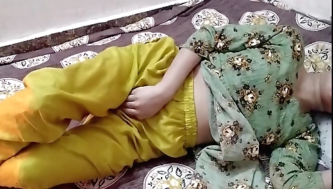 Indian woman is alone in her room and enjoys herself