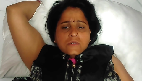 Indian girl in pantyhose is taking off her clothes