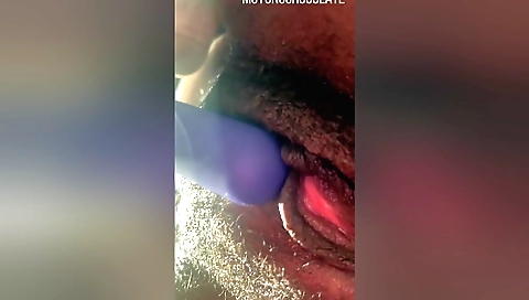 Horny woman plays with her toy and her hairy pussy