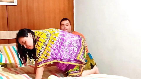 Indian brunette is having fun with her friend in the room
