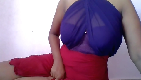 Beautiful Indian woman is dancing in front of a webcam