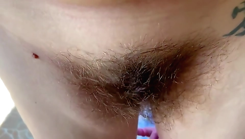 hairy milf in a white blouse in a park in the park