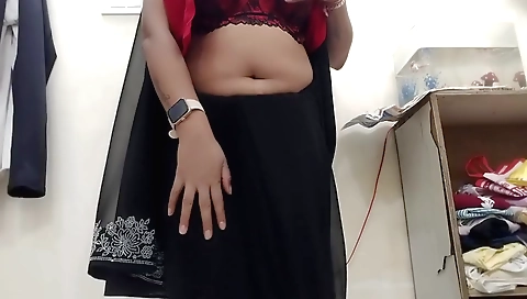 Indian hottie with a sexy black sari and tits in the solo clip
