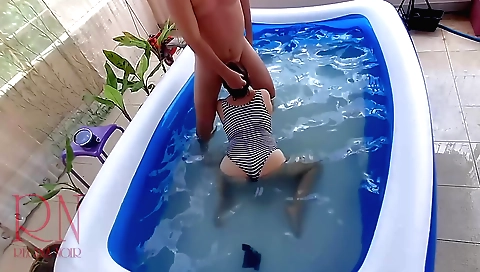 Brunette girl is in the pool and she is fucking herself