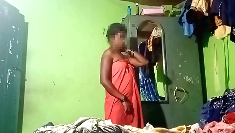 Indian girl 18+ in a red bath dress takes off her clothes